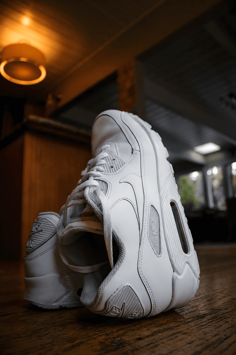 Minimal white sneakers on clean studio surface
