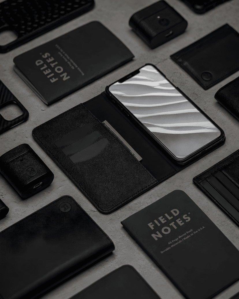 Leather accessories arranged on neutral surface